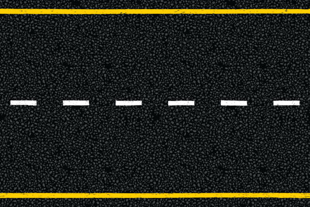 istock Yellow and white dotted highway traffic marks lines on tarmac road top view 1439869587