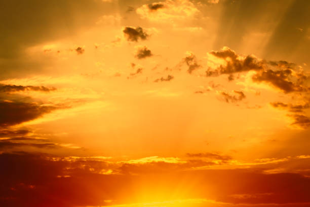 istock Stunning romantic and relaxing sunrise with some pink illuminated clouds moving across a blue sky. Long exposure, natural background 1439870237