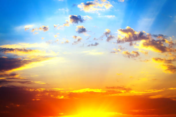 istock Stunning romantic and relaxing sunrise with some pink illuminated clouds moving across a blue sky. Long exposure, natural background 1439870268