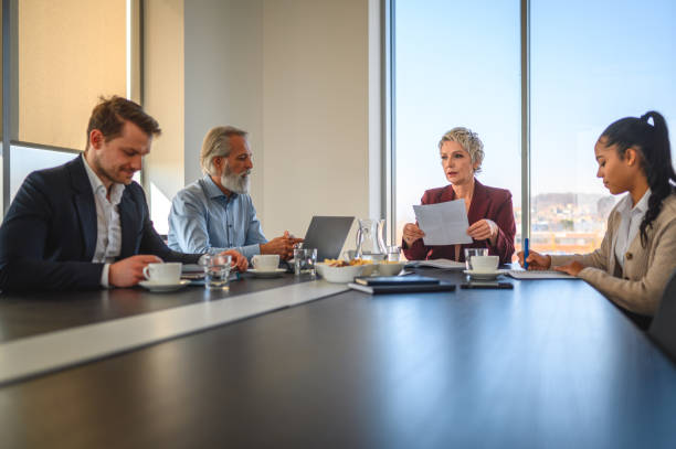 istock Team Meeting Between Diverse Adults Wearing Formalwear 1439873464