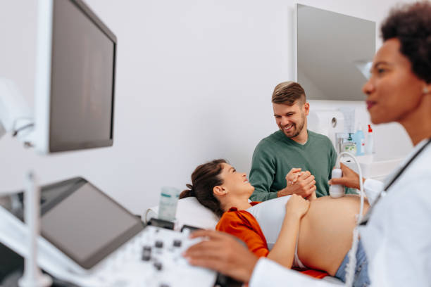 istock Cheerful couple at maternity clinic. 1439879853