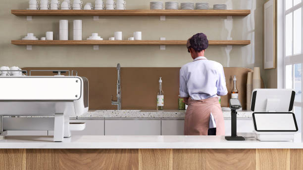 istock Close up of digital cash register with blank computer touch screen with tablet and bar code reader on counter, espresso maker and female barista making coffee in modern and luxury cafe 1439881487