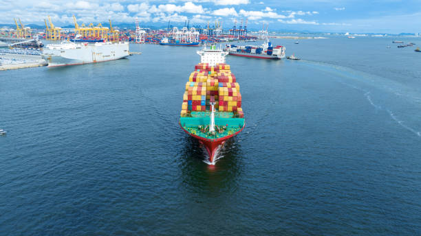 istock cargo maritime ship with contrail in the ocean ship carrying container and running for export concept technology freight shipping by ship smart service forwarder. front view 1439882728