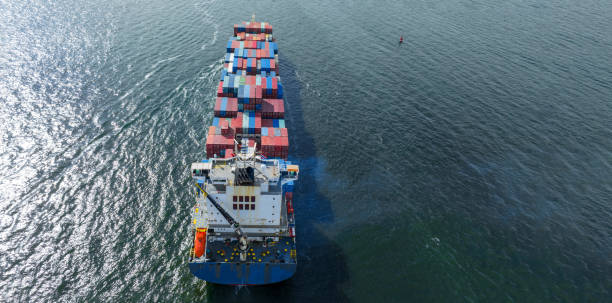 istock cargo maritime ship with contrail in the ocean ship carrying container and running for export concept technology freight shipping by ship smart service forwarder. stern container ship 1439882729