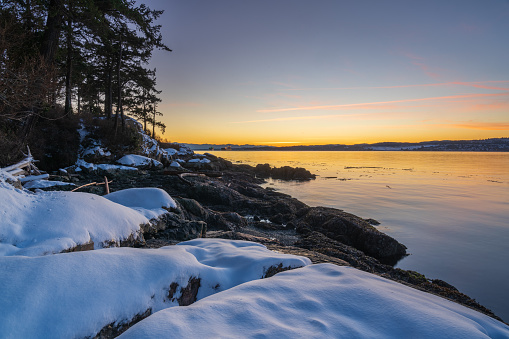 Sunset at Saxe Point on a cold snowy day in Victoria, BC.