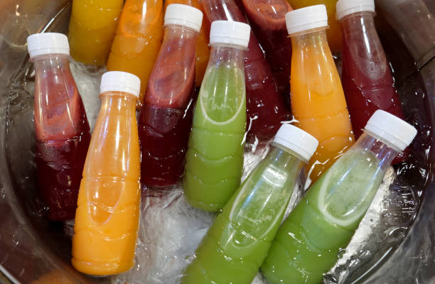 istock Different juices in bottle. Fresh tropical fruit 1439887702