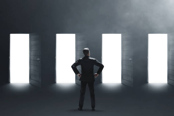 istock Business man standing 3d illustration on dark background 1439893504