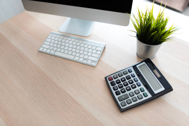 istock A calculator and computer are placed on the desk 1439897073