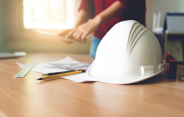 istock female engineer drawing equipment on the table. 1439897083