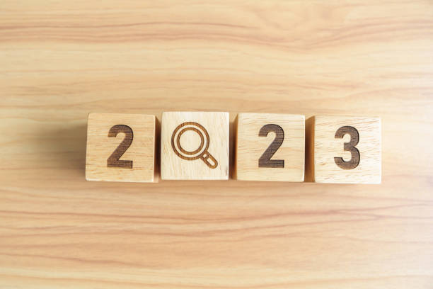 istock 2023 block with magnifying glass icon. SEO, Search Engine Optimization, hiring , Advertising, Idea, Strategy, marketing, Keyword, Content and New Year start concepts 1439897661