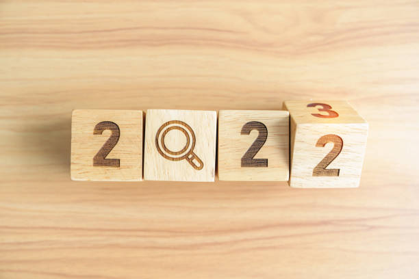 istock 2022 change to 2023 block with magnifying glass icon. SEO, Search Engine Optimization, hiring , Advertising, Idea, Strategy, marketing, Keyword, Content and New Year start concepts 1439897668