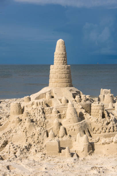 istock Dauphin Island - Rain-pocked Sandcastle Vertical in Morning Light 1439899241