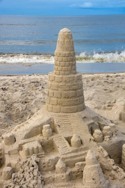 istock Dauphin Island - Rain-pocked Sandcastle Close-up Vertical 1439900295