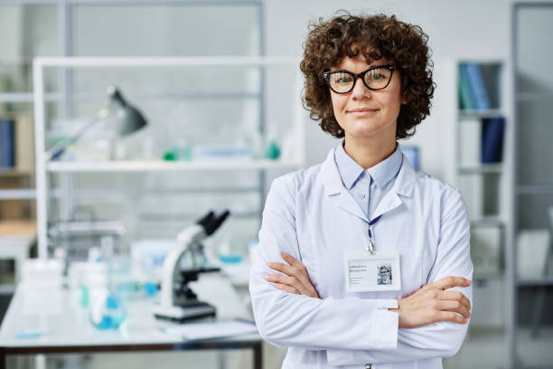 istock Young successful brunette female clinician or scientific expert in labcoat 1439901421