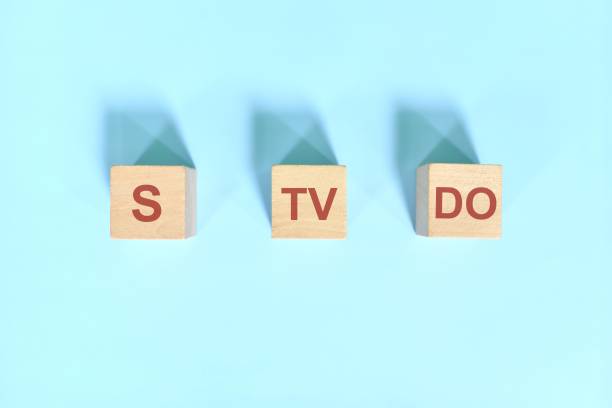 istock S TV DO basic sentence pattern English grammar concept. Wooden blocks flat lay on blue background. 1439905690