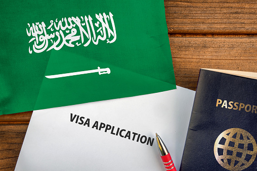 passport and flag of Saudi Arabia