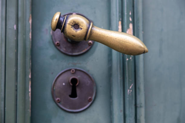 istock Old metal door knob with a rusty keyhole plate below (focus on the handle) 1439912229