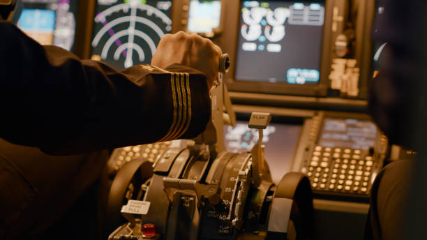istock Aircraft captain in cockpit command taking off with airplane 1439914285