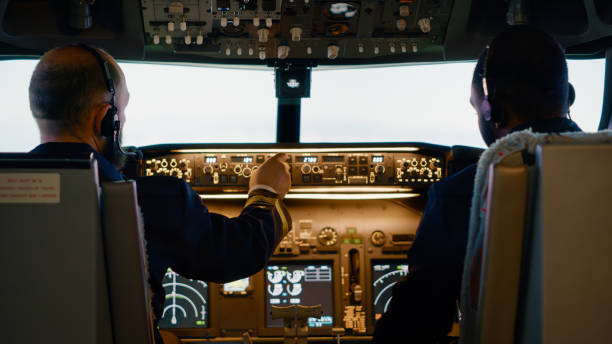 istock Diverse team of aviators preparing to takeoff with airplane 1439914325