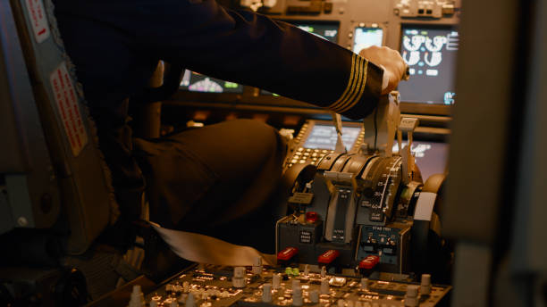istock Aviation crew flying airplane with engine lever to throttle 1439914354