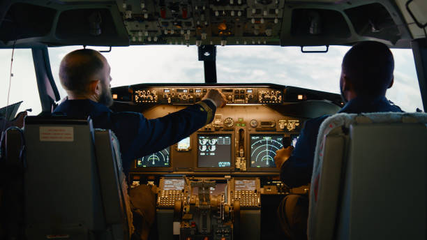 istock Captain switching buttons to fix altitude and longitude 1439914510