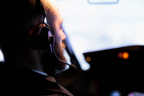 istock Male aviator looking through windscreen to fly aircraft 1439915609