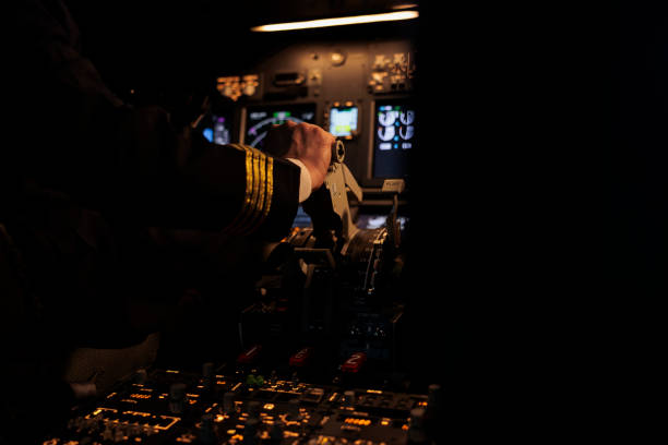 istock Male captain throttling engine to takeoff with aircraft jet 1439915809