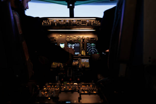 istock Multiethnic team of captain and pilot switching engine throttle 1439915844