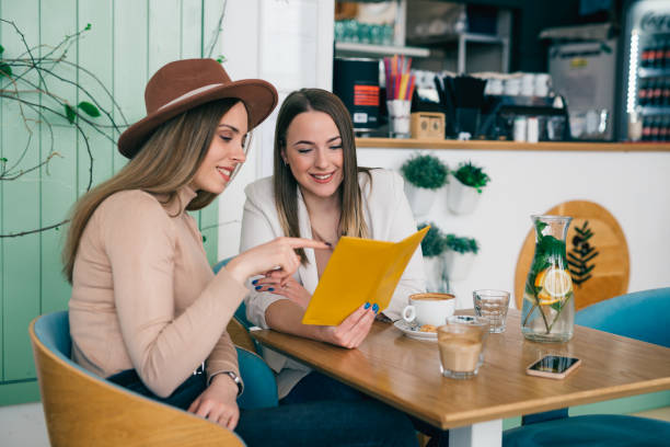 istock woman looking menu in restaurant 1439915996