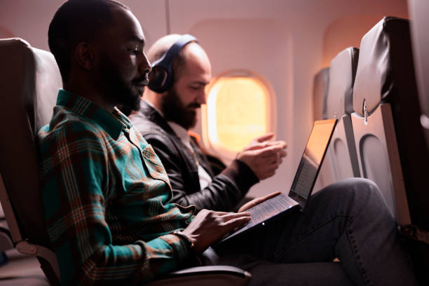 istock Young freelancer travelling on work trip by airplane 1439916128
