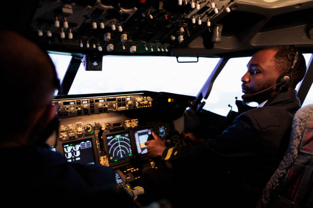 istock African american pilot flying aircraft jet doing teamwork with captain 1439916258