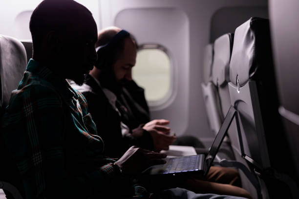 istock Diverse group of tourists travelling abroad by airplane 1439917076