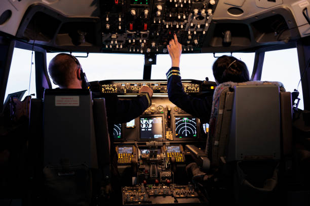 istock Captain and woman copilot getting ready to fly airplane 1439917175