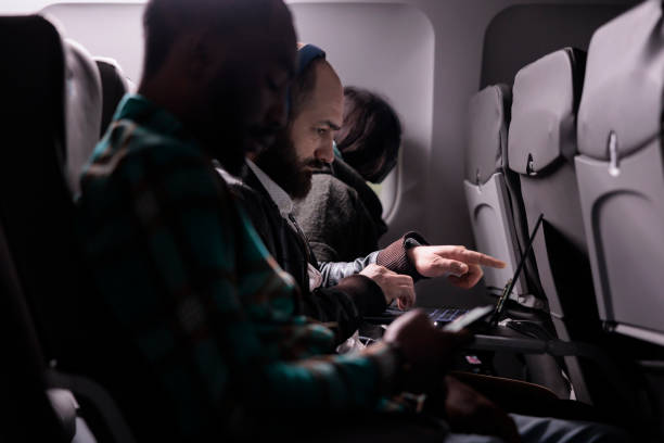 istock Sitting passengers flying in economy class with airplane 1439917278