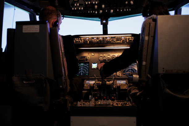 istock Team of captain and copilot throttling engine to fly airplane 1439917594