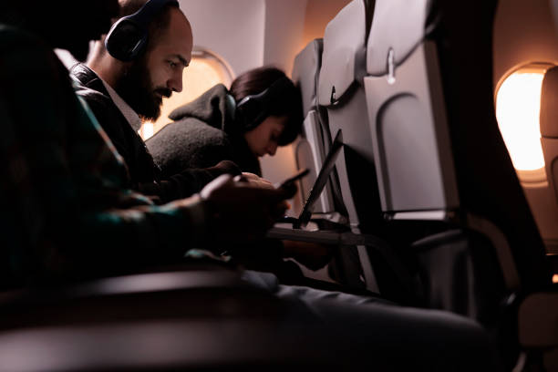 istock Diverse group of people travelling on commercial flight 1439917626