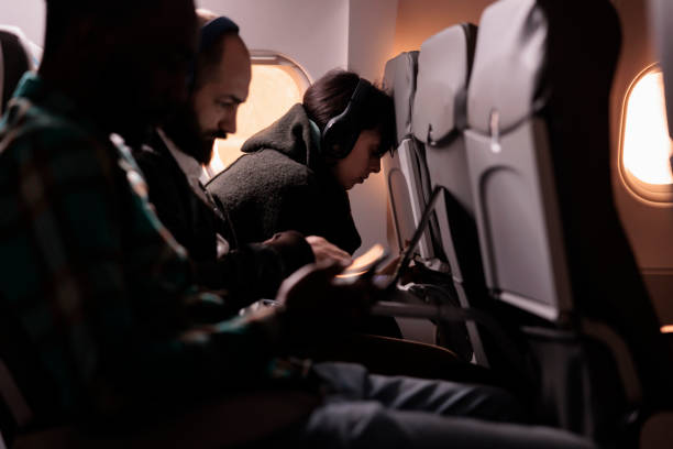 istock Multiethnic group of tourists travelling on commercial flight 1439918454