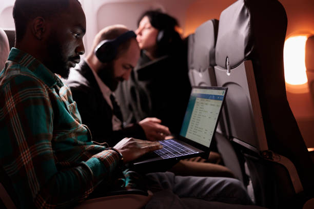 istock Diverse group of passengers flying in commercial class together 1439918626