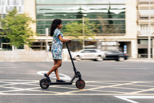 istock African Girl Riding Electric Scooter 1439918708