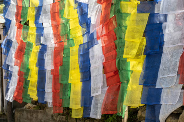 The prayer flags initiate peace and good tidings, their sacred mantras etched on the wind.