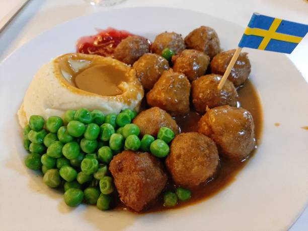 istock ikea's appetizing swedish meatballs with mashed potato, gravy, green peas and jam 1439919284