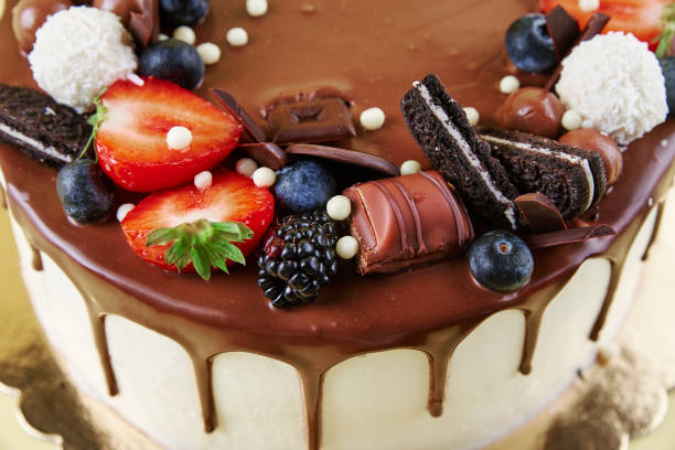 istock Cake decorated with strawberry and chocolate on yellow background 1439927074