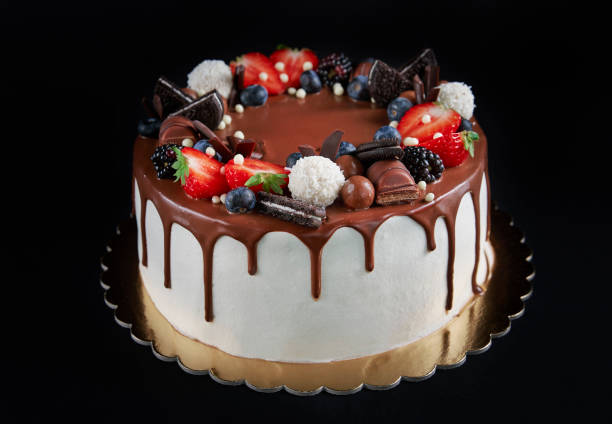 istock Cake decorated with strawberry and chocolate on dark background 1439927076