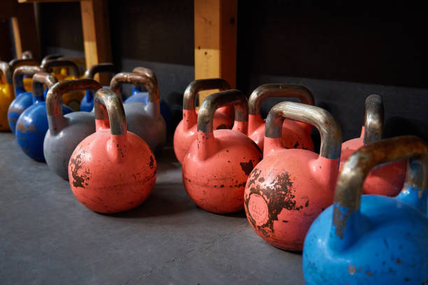 istock Colorful kettlebells in gym on the floor 1439927316