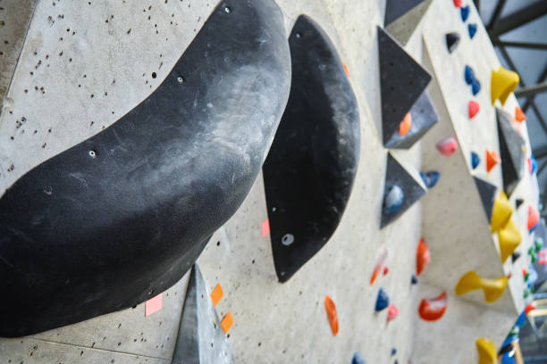 istock Bouldering gym with artificial colourful rock wall 1439927351