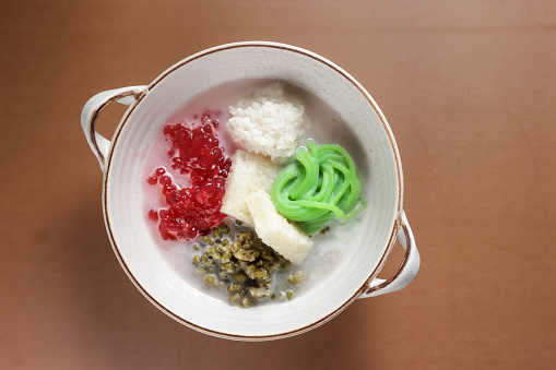 Wedang Angsle is a traditional Javanese warm dessert made of rice noodle, sago pearls, mung beans and other in ginger and coconut milk soup.