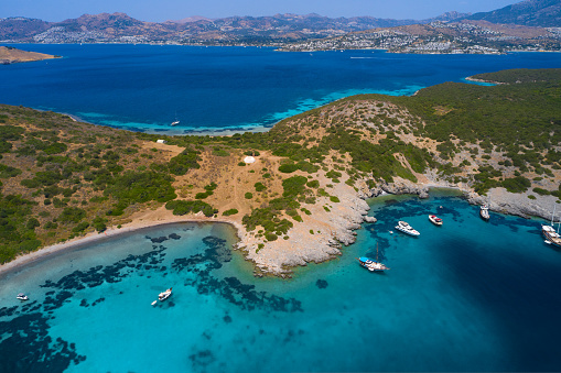 Aerial view of blue sea, islands, yachts along the mediterranean coast. Landscape of turkish riviera nature