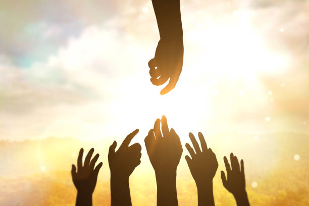 istock silhouette of hands on sunset background, 1439930235