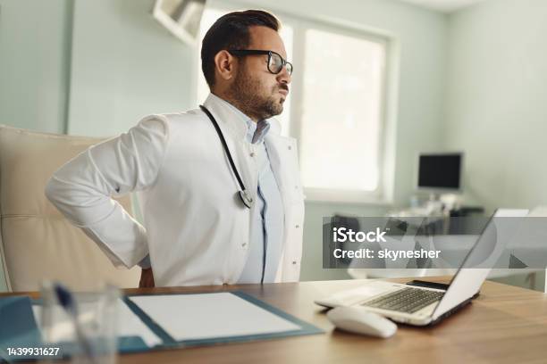 Ugh I Have Terrible Backache Stock Photo - Download Image Now - Emotional Stress, Surgeon, Adult