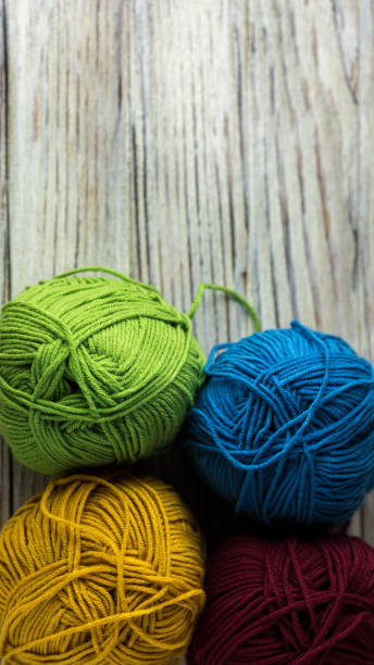 istock multi-colored threads for knitting and knitting needles. Selection of colorful wool yarn. Yarn for knitting winter clothes with your own hands. High quality photo 1439934498